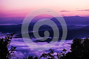 Sunset overlooking mountains with Mist