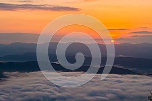 Sunset overlooking mountains with Mist