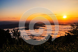 Sunset overlooking mountains with Mist