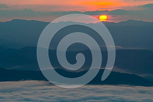 Sunset overlooking mountains with Mist