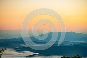 Sunset overlooking mountains with Mist