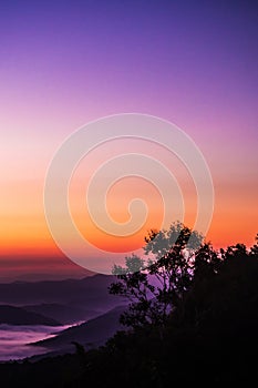 Sunset overlooking mountains with Mist