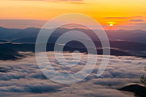 Sunset overlooking mountains with Mist