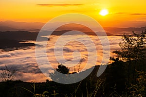 Sunset overlooking mountains with Mist