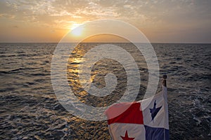 Sunset and Panama Flag waving with the sea in The San Blash Island