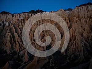 Sunset panorama of Arriba Fossil da Praia da Gale Fontainhas hoodoo fairy chimney earth pyramid rock formation Portugal