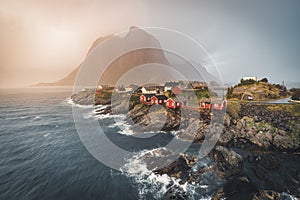 Sunset Panorama of famous tourist attraction Hamnoy fishing village on Lofoten Islands near Reine, Norway with red rorbu