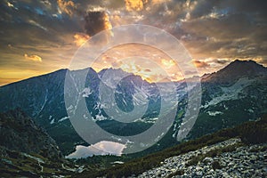 Sunset panorama in High Tatras mountains national park. Mountain popradske lake in Slovakia.