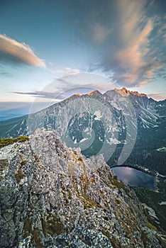 Sunset panorama in High Tatras mountains national park. Mountain popradske lake in Slovakia.