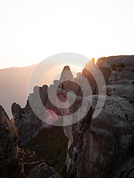 Sunset panorama hiker poncho on Marcahuasi andes plateau rock formations mountain hill valley nature landscape Lima Peru