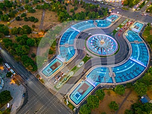 Sunset panorama view of a fountain at the Unirii square in Bucha