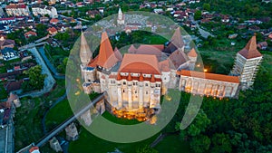 Sunset panorama view of the Korvin castle in Hunedoara, Romania photo