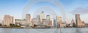 Sunset panoramic view of Canary Wharf buildings - London, UK