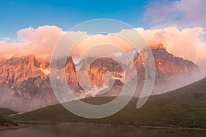 Sunset in Passo Rolle - Baita Segantini lake in Dolomite mountain range, Italy