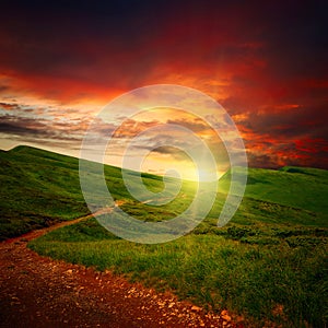 Sunset and path through a meadow photo