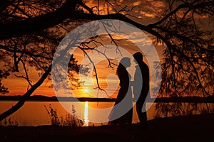 Sunset photo of silhouettes of a couple in love