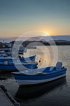 Sunset at the pier of Aheloy on the Black Sea with fishing boats