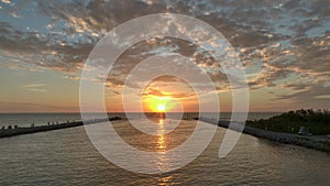 Sunset at the Pier with Beautiful Gradient Sky a Drone Shot Flying towards the Sun