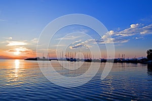 Sunset on the pier on the island of Aegina in Greece on the Mediterranean Sea