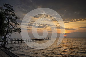 Sunset and pier in kep on cambodia coast