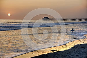 Sunset at the Pier in Oceanside beach, California.