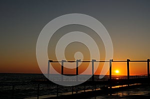 Sunset on the pier in Sochi. A wonderful summer in Sochi. Create brilliant vibrant colors