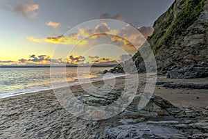 Sunset at Polkerris Beach in Cornwall, England photo