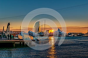 Sunset at the Port of Barcelona, Spain. Twilight seascape on Rambla De Mar