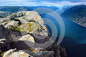 Sunset at Preikestolen Preacher`s Pulpit rock over Lysefjord, Norway