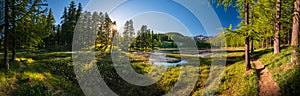 Sunset in the Queyras Nature Park with Lac de Roue lake. Hautes-Alpes, French Alps