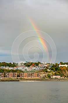 Sunset with rainbow view of the Levis city and St Lawrence River