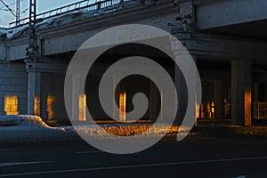 Sunset rays under road bridge industrial landscape