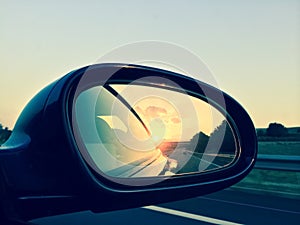 Sunset in a rear view mirror photo