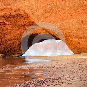 Sunset at red arches of Legzira beach