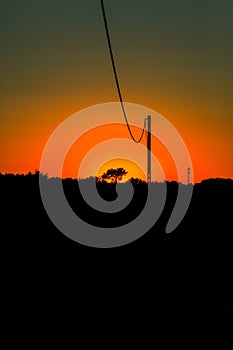 Sunset with red sky and black foreground