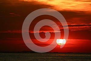 sunset on red yellow sky back soft evening cloud over horizon sea