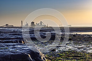 Sunset at Redcar with Industrial background. photo
