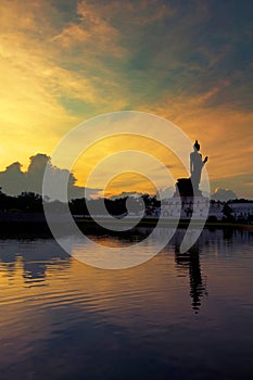 Sunset and reflaction Buddha statue, Thailand