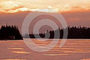 Sunset Reflected In The Ice On Island Lake