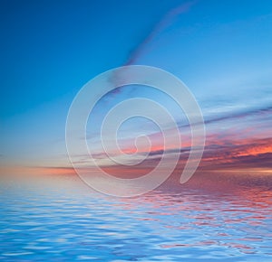 Sunset reflected in water.