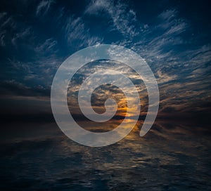 Sunset reflected in water.