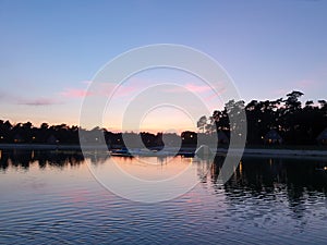 Sunset reflecting on a lake at park `t Loo in Oldebroek in the Netherlands.