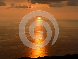 Sunset reflecting in the ocean photo