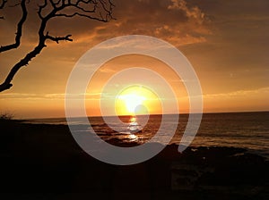 Sunset reflecting over ocean at Kua Bay Big Island Hawaii