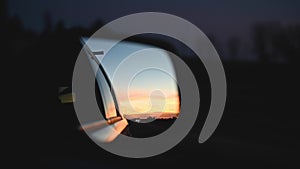 Sunset reflection in car mirror