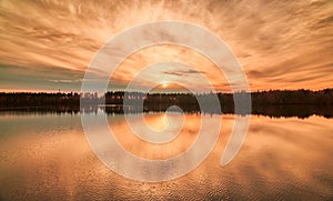 Sunset reflection by the river.