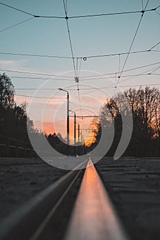 Sunset in reflection of a tram rail