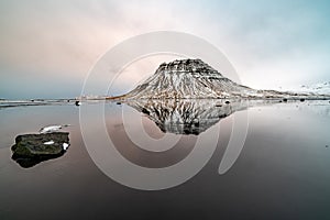 Sunset and reflections on the beautiful Kirkjufell mountain, Snaefellsness peninsula, Iceland