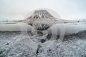 Sunset and reflections on the beautiful Kirkjufell mountain, Snaefellsness peninsula, Iceland