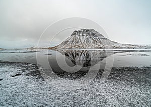 Sunset and reflections on the beautiful Kirkjufell mountain, Snaefellsness peninsula, Iceland